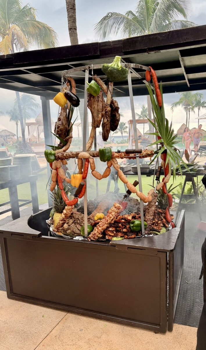 Delicious grilled meats and vegetables at a tropical outdoor BBQ in Akumal, Riviera Maya.