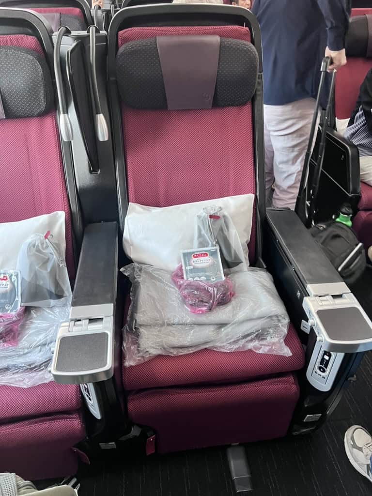 Premium Economy seat with amenities on Japan Airlines Boeing 787-9.