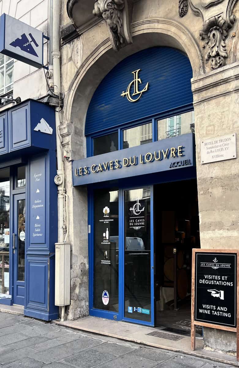 Entrance to Les Caves du Louvre wine cellar in Paris, France.