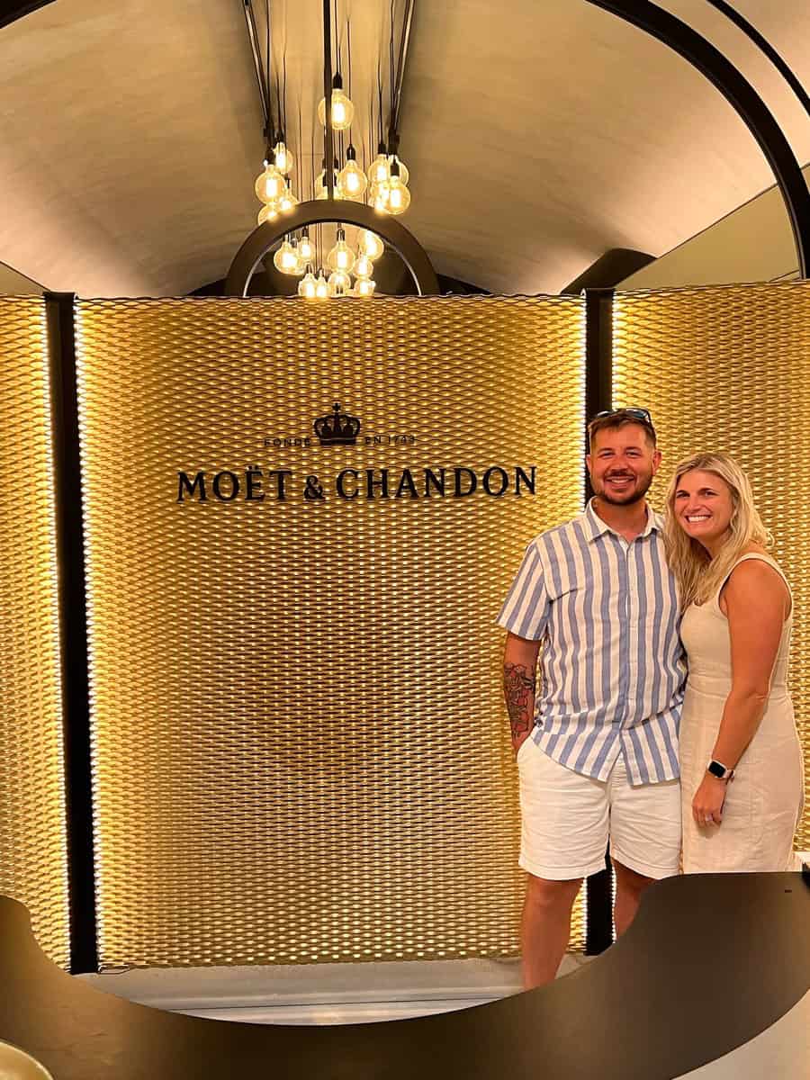 Couple enjoying a romantic moment at Moët & Chandon champagne bar in Paris.