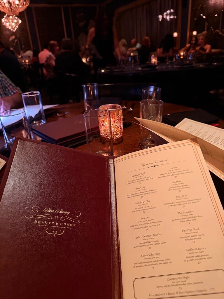 Elegant restaurant table setting with candlelight and menu at a fine dining venue.