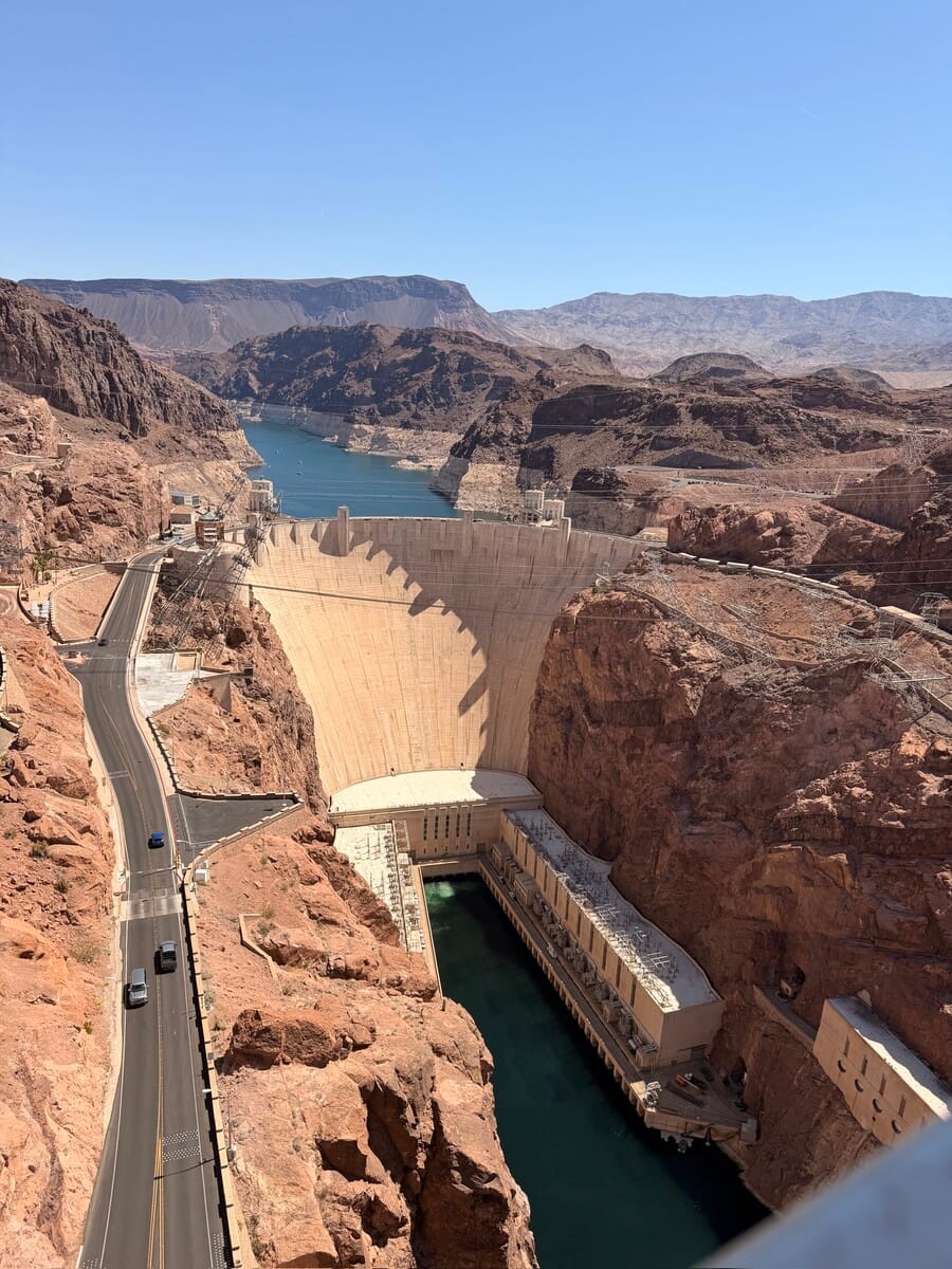 Hoover Dam on the Colorado River with surrounding canyon landscape.