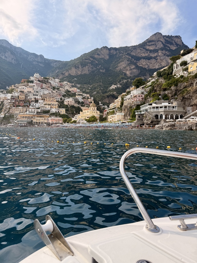 Scenic view of Amalfi Coast with colorful houses on cliffs and blue sea.